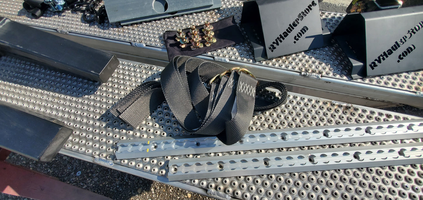 Straps and metal brackets on a textured surface with visible branding.